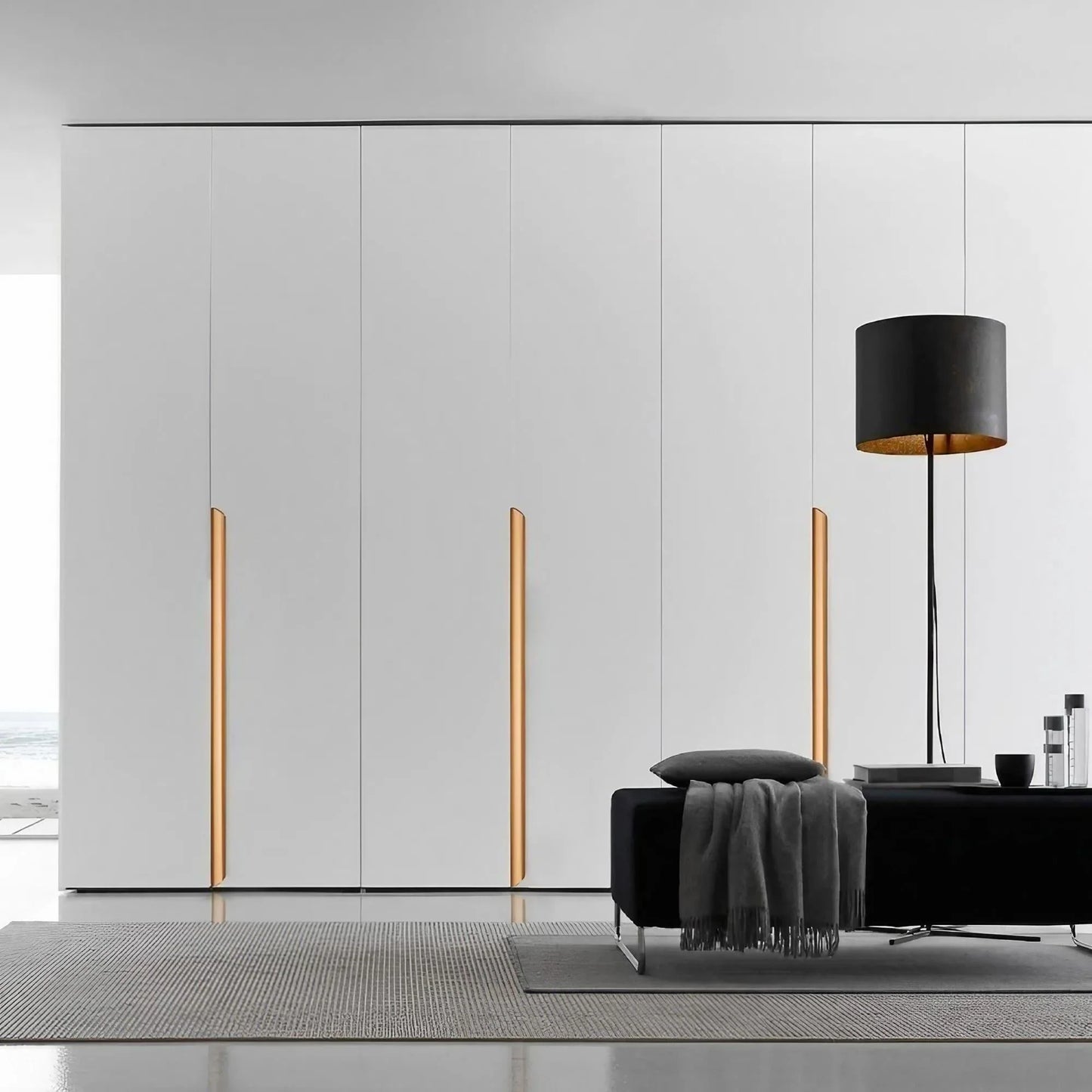Gold long cabinet edge pulls on the wardrobe