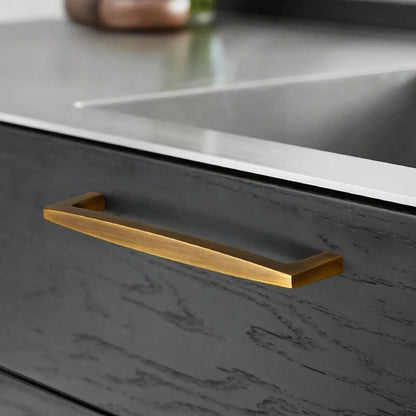 Brushed Brass kitchen cabinet handles installed on modern drawers with minimalist cabinet design